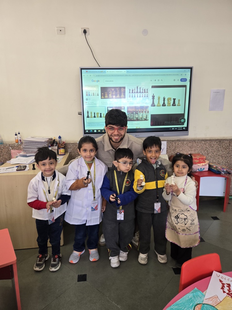 Shubh Bhola with young chess students